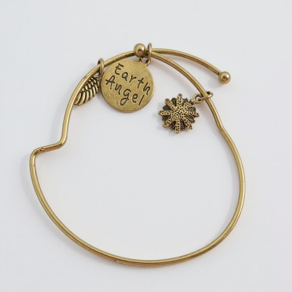Earth Angel Expandable Bracelet Charms Tree /Flower/  Wings in good condition